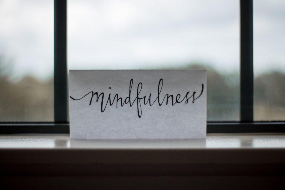 Mindfulness sign sitting in front of window