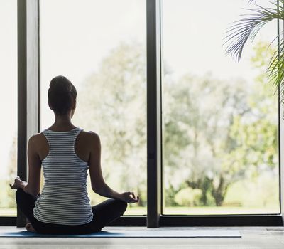 Woman meditating at home