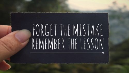 Motivational and inspirational quote - Forget the mistake, remember the lesson. Blurred vintage styled background.
