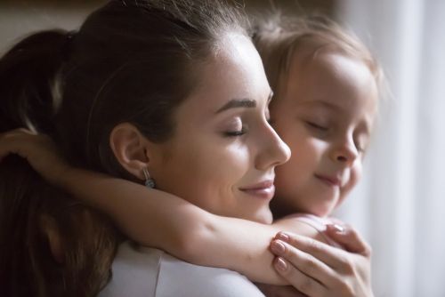 Mom and child embracing