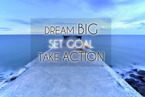 Motivational image with ocean in background and words that say dream big, set goal, take action