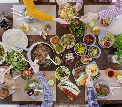 Healthy and colorful diet meal with friends, top view 