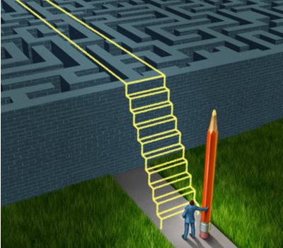 businessman holding a pencil drawing a stairway bridge over the obstacle.